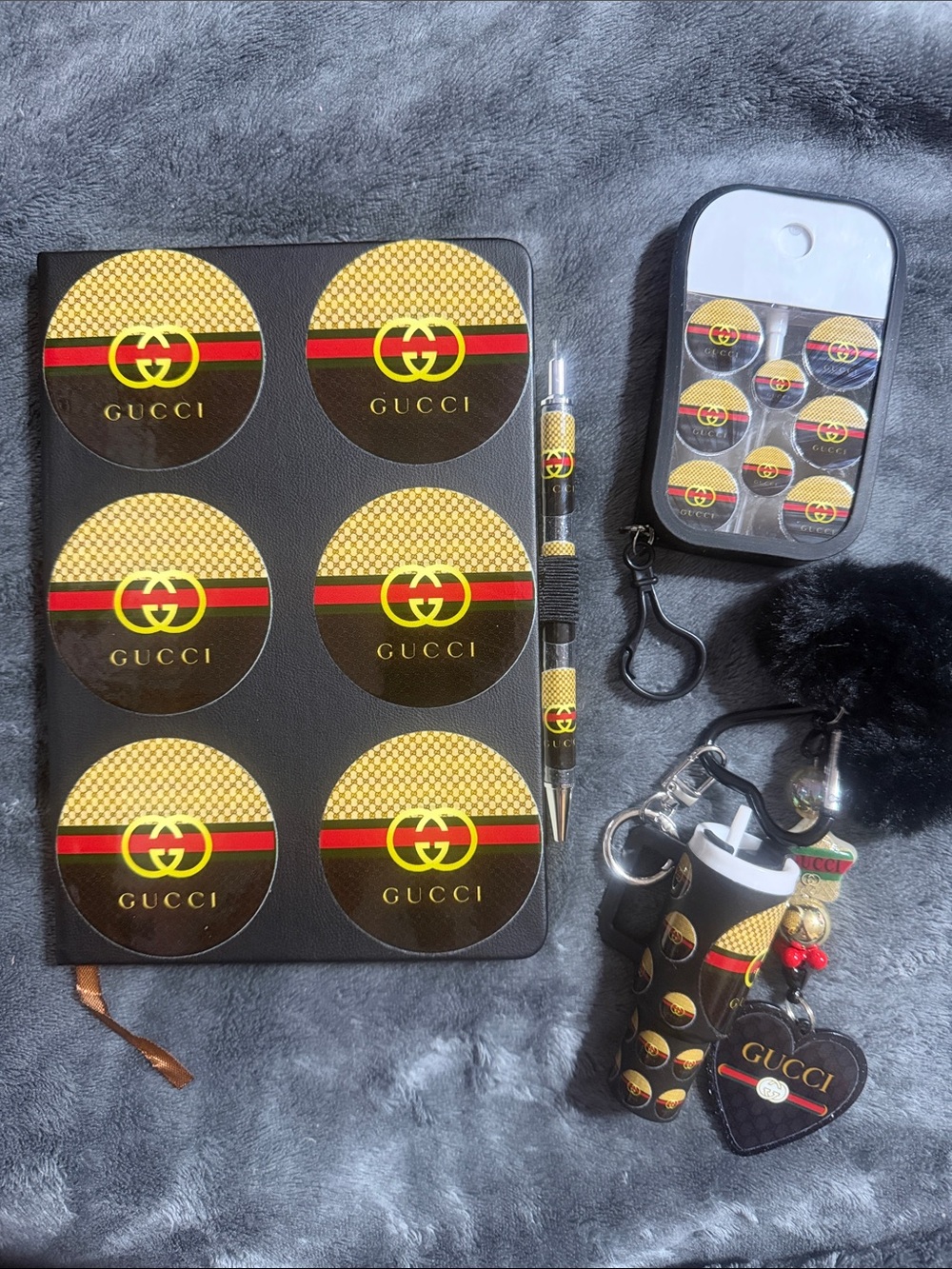 Black and tan journal with matching pen, keychain & sanitizer spray bottle.
